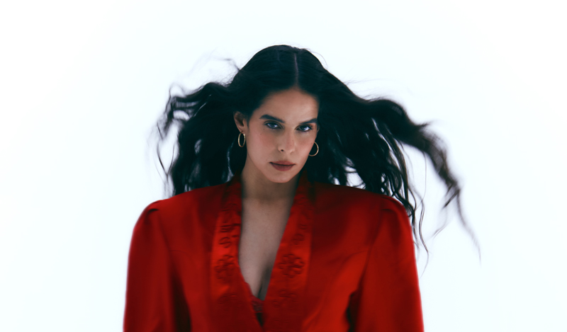 Ángeles Toledano - Photo by Mara Alonso. Ángeles in a red outfit.