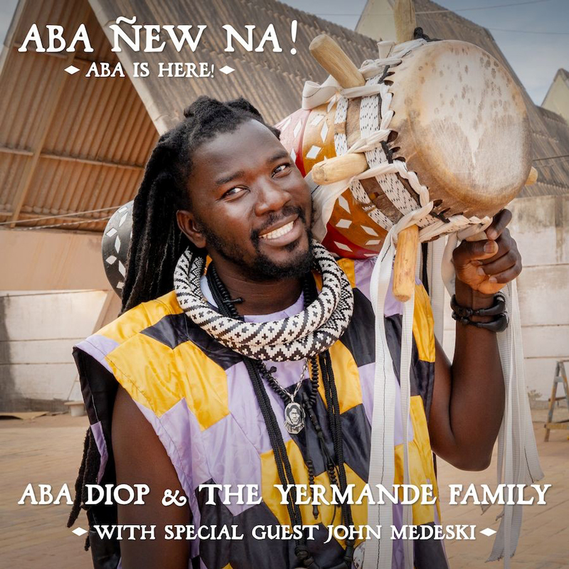 Aba Diop - Family cover artwork. A photo of Aba holding a drum.