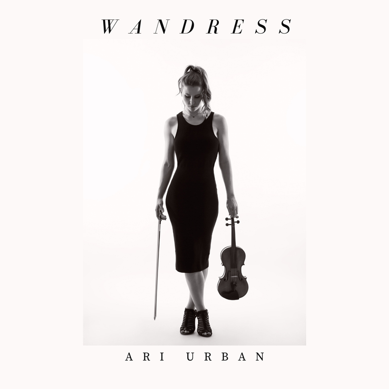 This elegant album cover for "Wandress" by Ari Urban features a minimalist, black-and-white design. The artist stands centered in a sleek black dress, holding a violin in one hand and a bow in the other.