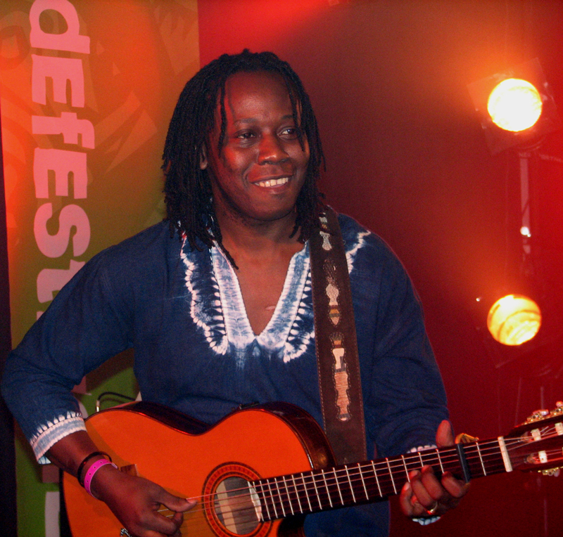 Aurelio Martínez playing guitar live in Norway - Photo by Angel Romero, 2010