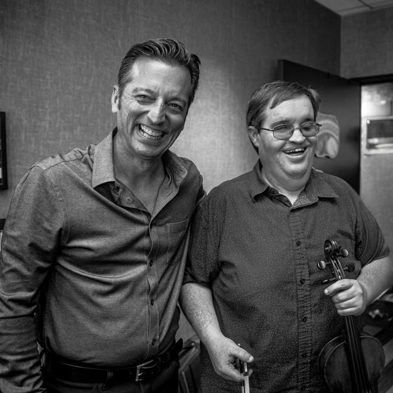 Carter & Cleveland Press Photo Credit Emma McCoury Photography. Black and white photo of the two artists smiling.