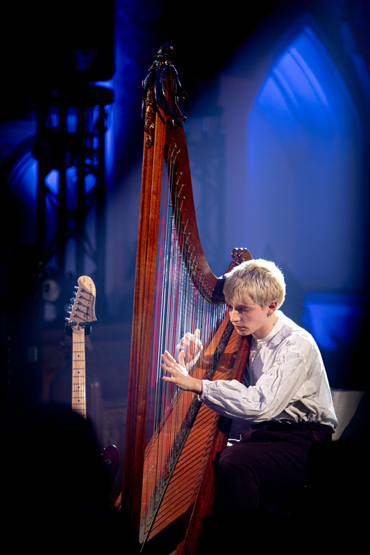 Cerys Hafana - Photo by Jennie Caldwell. Cerys playing harp.