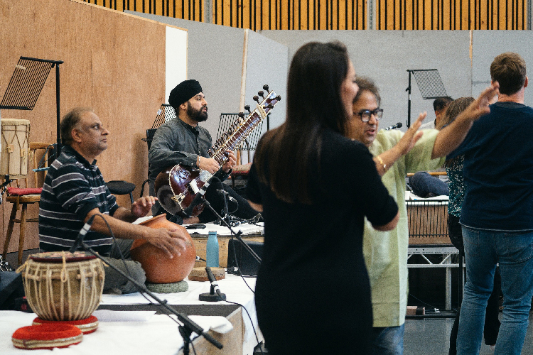Co-Music Director and sitarist Jasdeep Singh Degun with cast and creatives in Orpheus rehearsals - Photo by Tom Arber