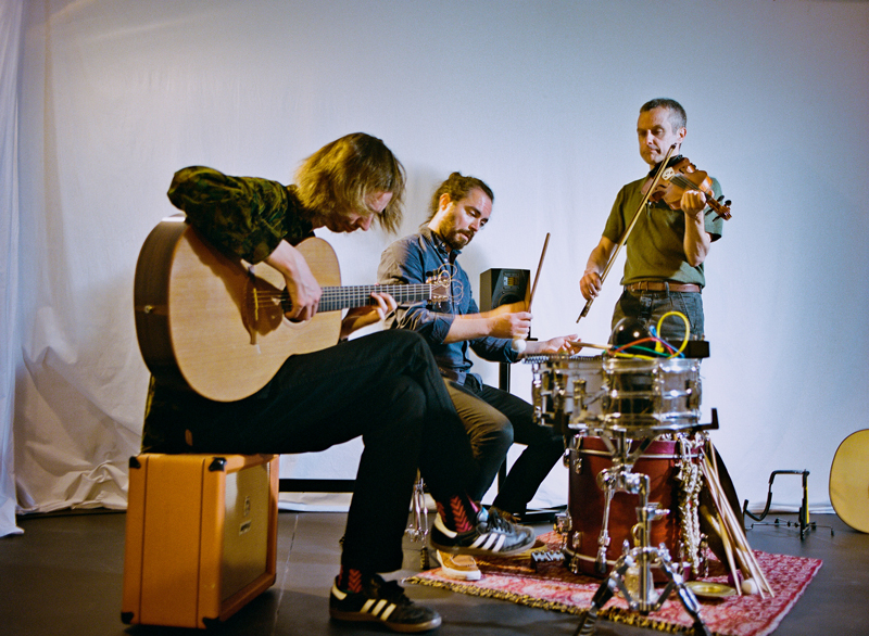 Córas Trio playing indoors.