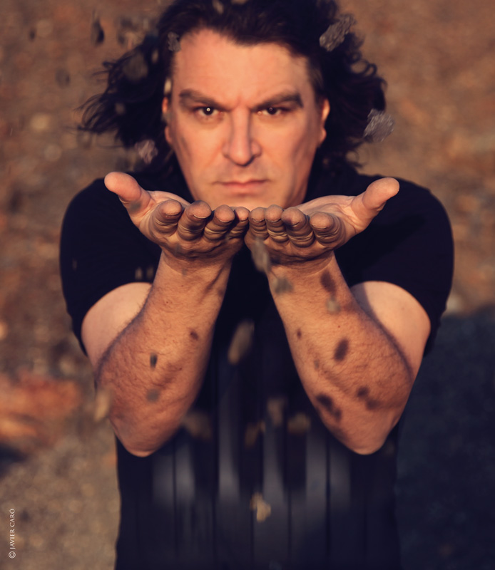 Dorantes - Photo by Javier Caró. Dorantes facing the camera with his hands extended towards the camera.