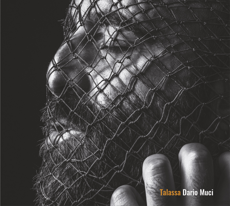 Dario Muci - Talassa cover artwork. a headshot of the artist wrapped in a fishing net.