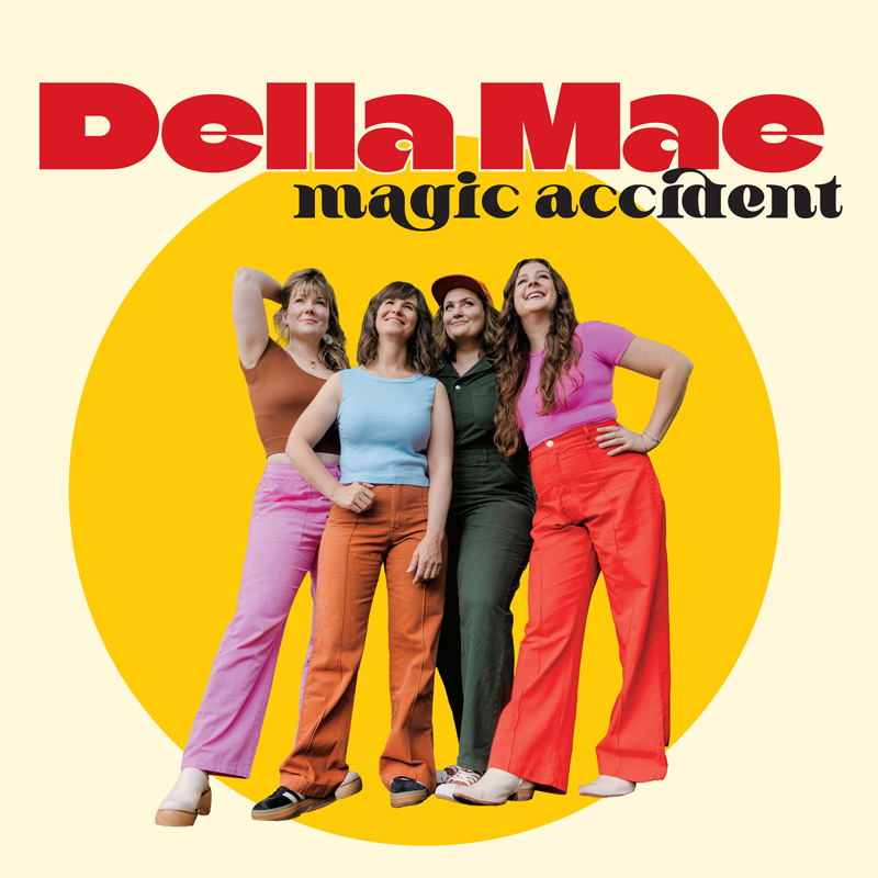 Della Mae Magic Accident cover artwork. a phyo of the four women wearing colorful pants and shirts including pik, red, blue and orange.