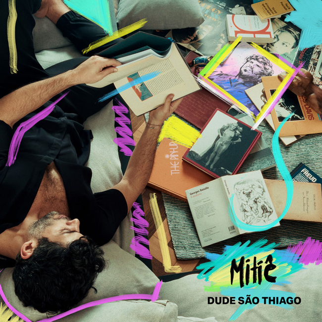 The cover for the single "Mitê" by Dude São Thiago features an eclectic design. It shows a man reclining on a surface surrounded by open books, magazines, and artworks. The scene is overlaid with colorful, abstract brushstrokes in neon shades of pink, yellow, blue, and green. The title "Mitê" and the artist's name are displayed prominently in a bold, handwritten-style font.