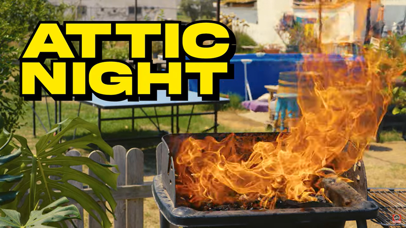 El Globo - Attic Night. an image from the music video. It shows an outdoor barbecue grill with large flames.