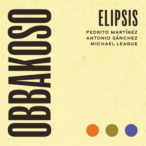he cover of “Obbakoso” by Elipsis features a pale yellow background. The single's title “Obbakoso” appears vertically along the left side in bold black lettering, while the band name Elipsis sits at the upper right, paired with the artists’ names—Pedrito Martínez, Antonio Sánchez, and Michael League—in smaller, uppercase text. At the bottom right, three colored dots—orange, olive, and violet.