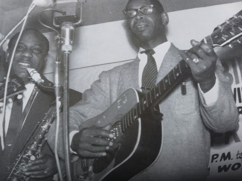 Elmore James, playing the guitar