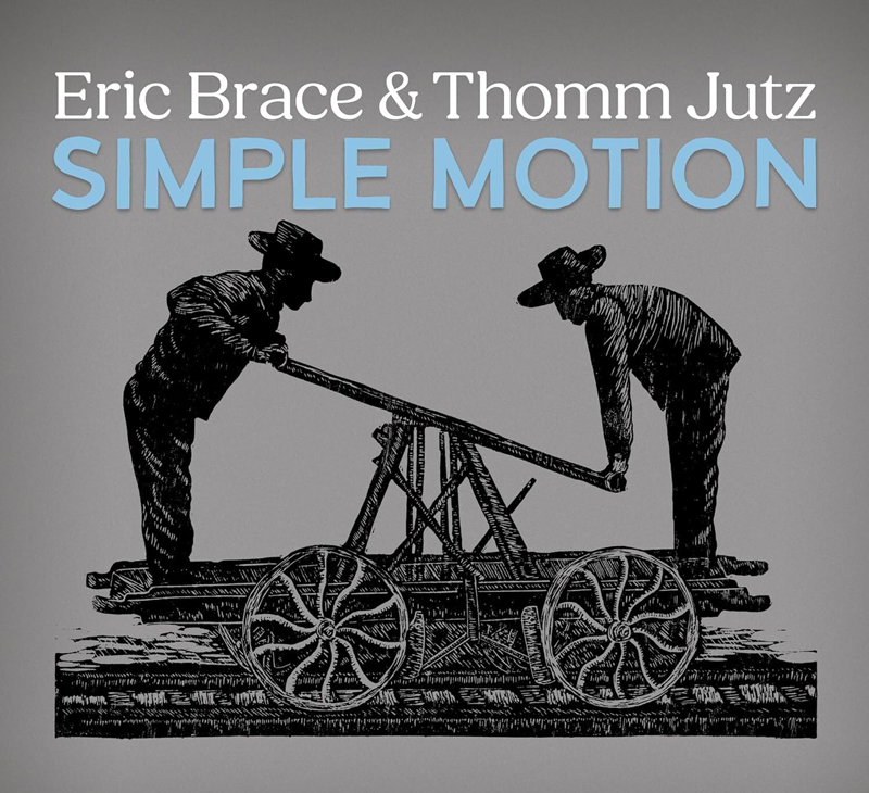 Eric Brace & Thomm Jutz - Simple Motion cover artwork. An image of two people pushing a railroad handcar.