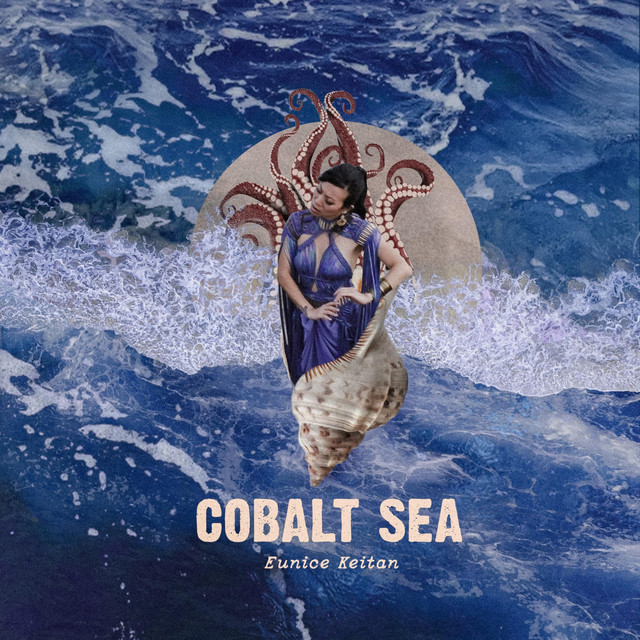 Eunice Keitan - Cobalt Sea single artwork. The artist wearing a blue dress sitting in a conch shell in the middle of the ocean.