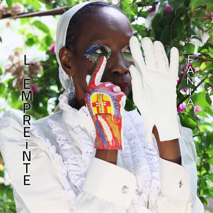 Fania Niang l empreinte cover artwork. A photo of Fania dressed in white with white gloves and scarf. one of her gloves and her eyes are painted with colorful designs.
