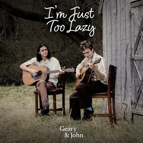 Geary & John -“I’m Just Too Lazy” cover artwork. The duo playing guitars outside a barn.