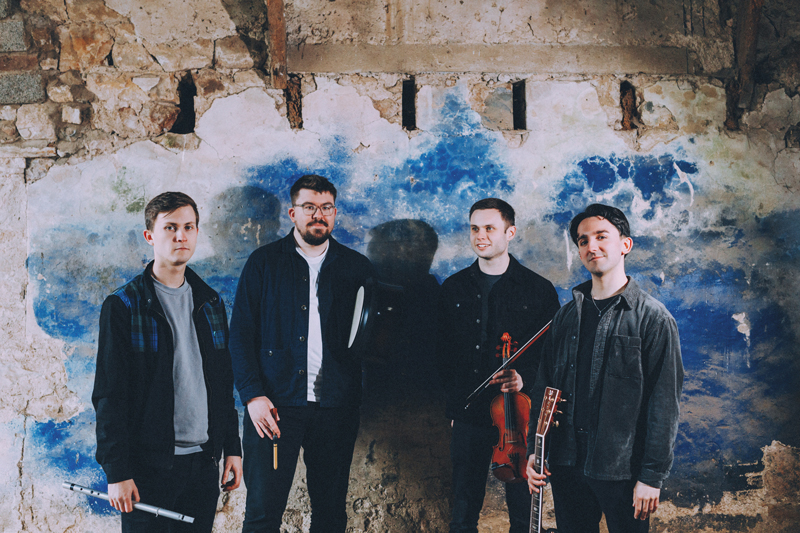 Gnoss - Photo by Elly Lucas. Band posing indoors.