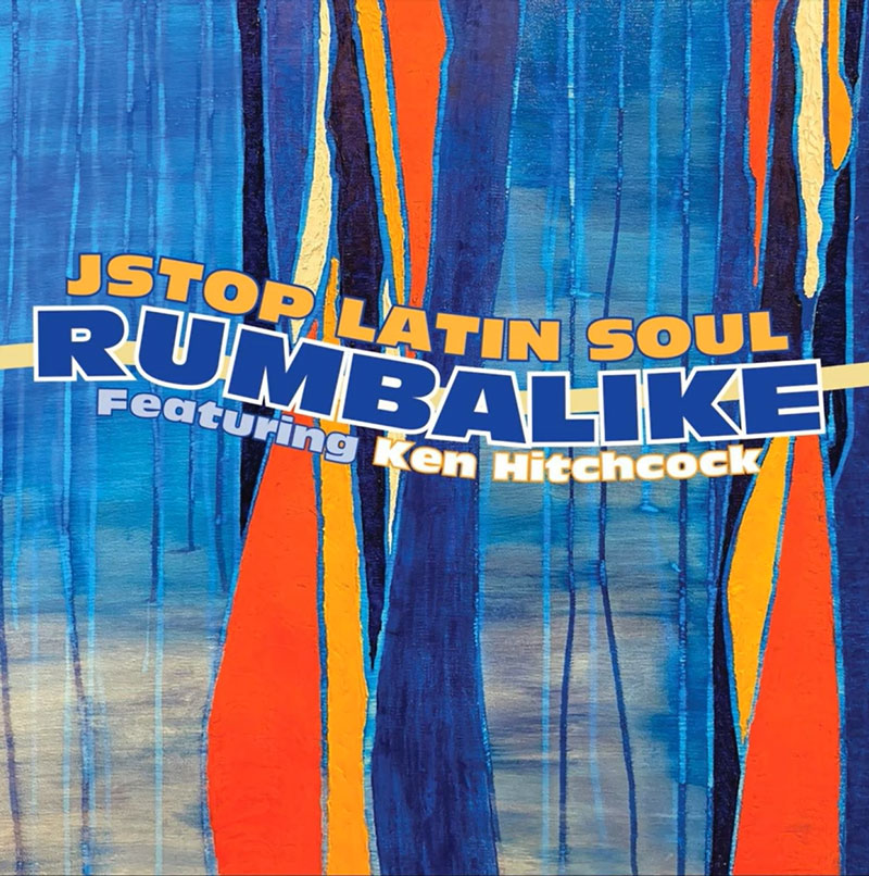 This album cover features an abstract design dominated by vertical streaks of blue, orange, and yellow hues. The album title, "Rumbalike," and the artist name, "Jstop Latin Soul Featuring Ken Hitchcock," are prominently displayed in bold, layered text.