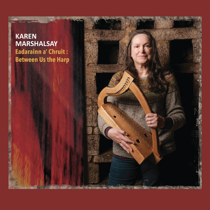 Karen Marshalsay - Eadarainn A’ Chruit: Between Us The Harp cover artwork. A photo ofKaen holding a small harp.