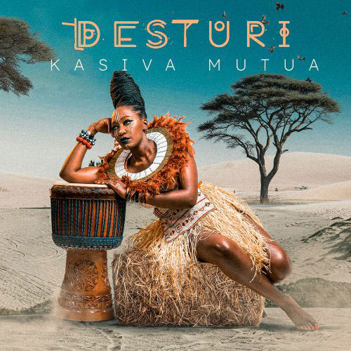 The album cover for Desturi by Kasiva Mutua features the artist seated beside a traditional African drum in a desert landscape, framed by acacia trees. She wears Afrocentric attire—including a grass skirt, beaded jewelry, and an elaborate neckpiece.