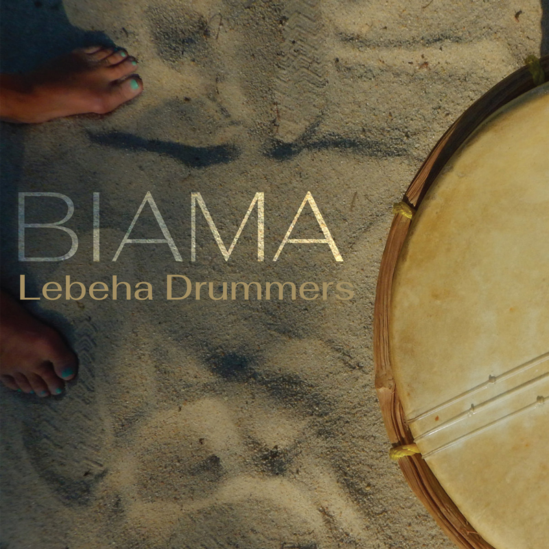 Lebeha Drummers - Biama cover artwork. A photo from above showing beach sand, someones feet with gree toenail polish and a partial shot of what looks like a musical instrument.