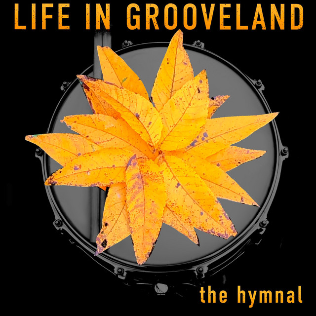 Life in Grooveland - The Hymnal cover artwork. A photo of a drum with yellow leaves on top.