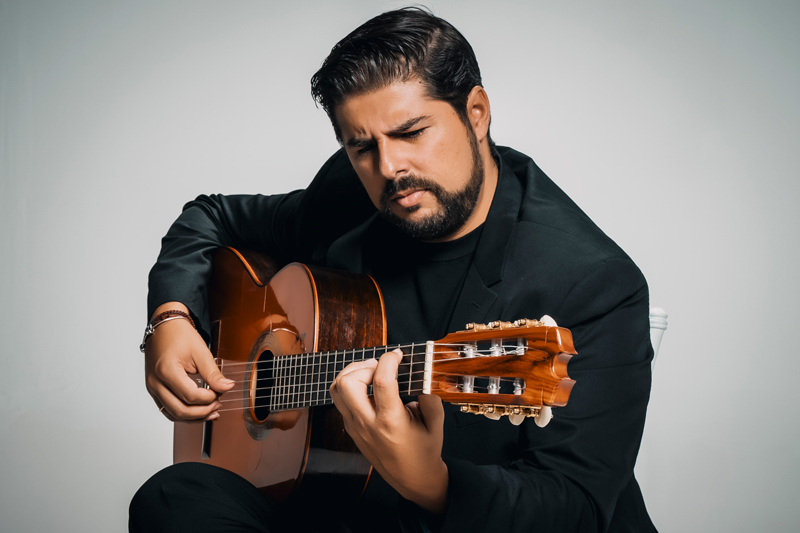 Manuel Valencia playing guitar