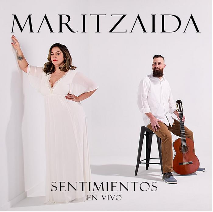 Maritzaida - Sentimientos en vivo cover artwork. A photo of the duo.