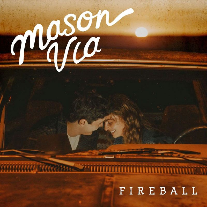 The cover for Mason Via's single Fireball features an intimate scene of a couple sitting in an old vehicle, leaning in with their foreheads touching.