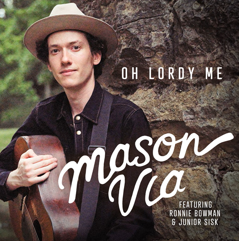 Mason Via Oh Lordy Me single cover. A color photo of the artist holding a guitar, wearing a hat.