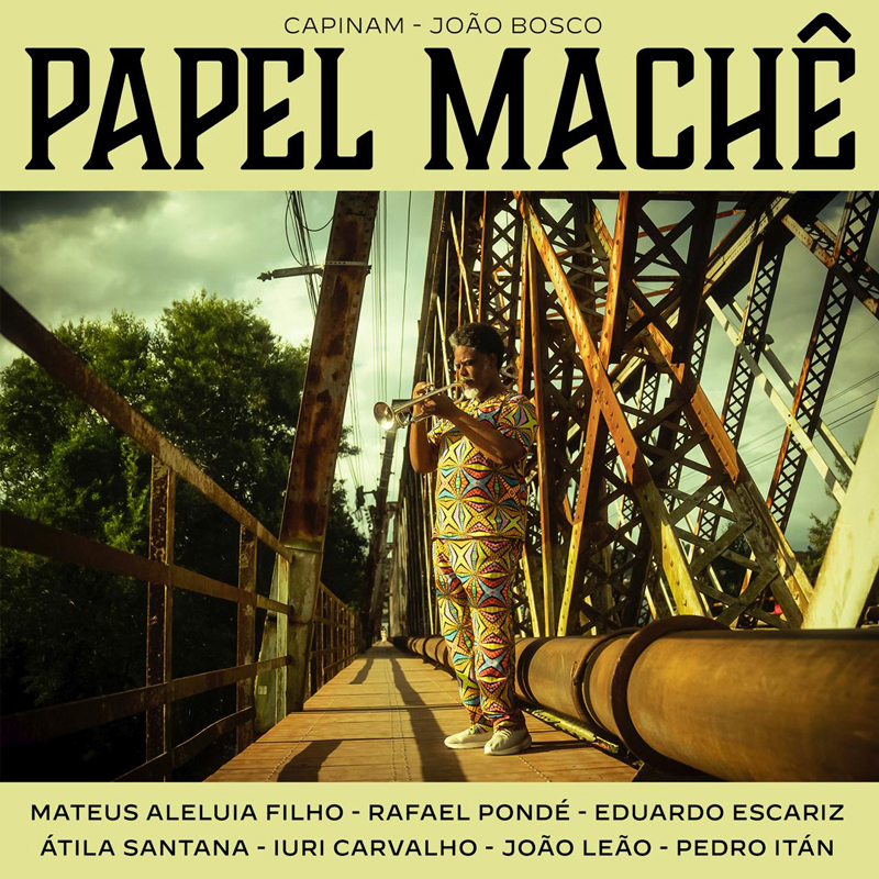 Mateus Aleluia Filho - Papel Machê cover artwork. A photo of the artist playing trumpet on top of a steel bridge.