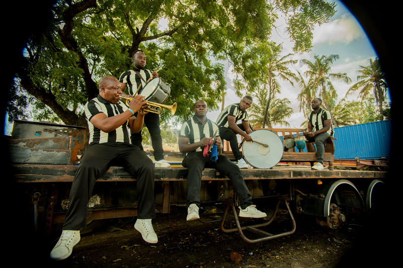 Msindaba Jazz Band playing on top of a flat bed outdoors.