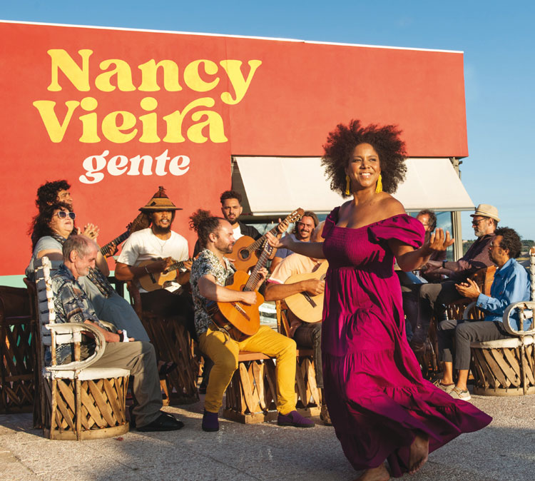 Nancy Vieira - Gente cover artwork. A photo of Nancy outdoors surrounded by musicians.