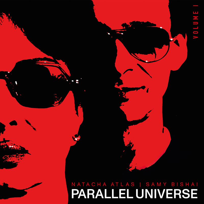 Natacha Atlas & Samy Bishai - Parallel Universe Vol 1 - Photo by Allison Fielding. A red and black photo of the two artists wearing eyeglasses.