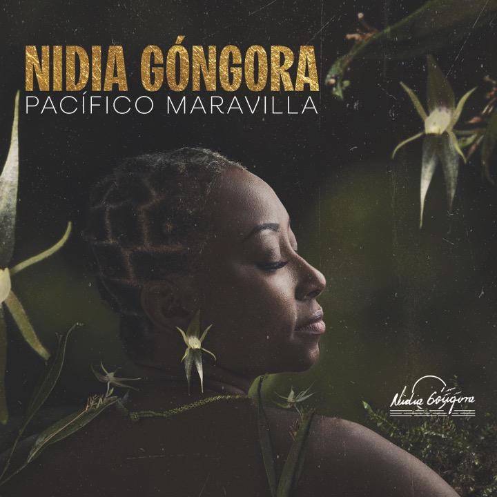 The album cover for Nidia Góngora – Pacífico Maravilla features a portrait of the artist in profile, eyes closed, surrounded by delicate, star-shaped orchids and lush greenery. Her hair is braided. Her name is in gold lettering.