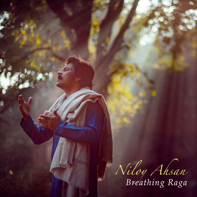 Niloy Ahsan - Breathing Raga cover artwork. The artist singing in a forest.