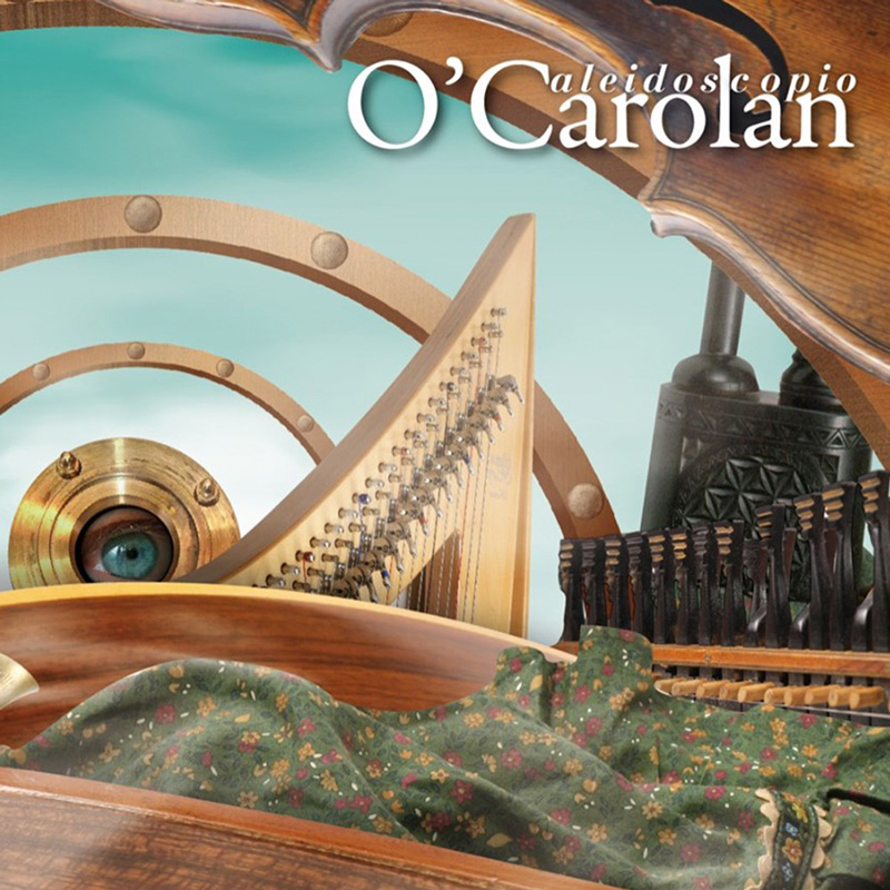 O' Carolan - Caleidoscopio cover artwork. A collage of traditional instruments and crafted objects fills the cover of O’Carolan's Caleidoscopio. A harp, violin, and what appears to be a hurdy-gurdy are arranged among circular wooden and brass forms, including an eye-like lens at the center.