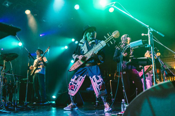 Oki Dub Ainu Band playing live.