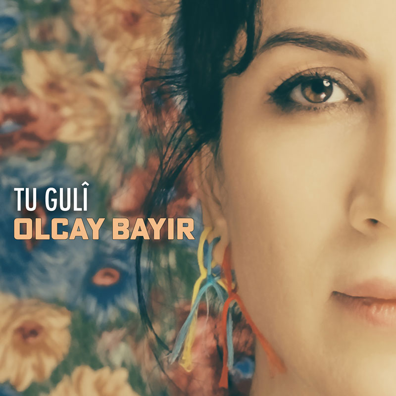 Olcay Bayir - Tu Guli cover artwork. A partial headshot of the artist.