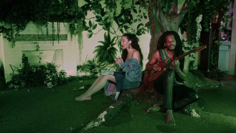 Paul Beaubrun and Naïka Fèy sitting under a tree