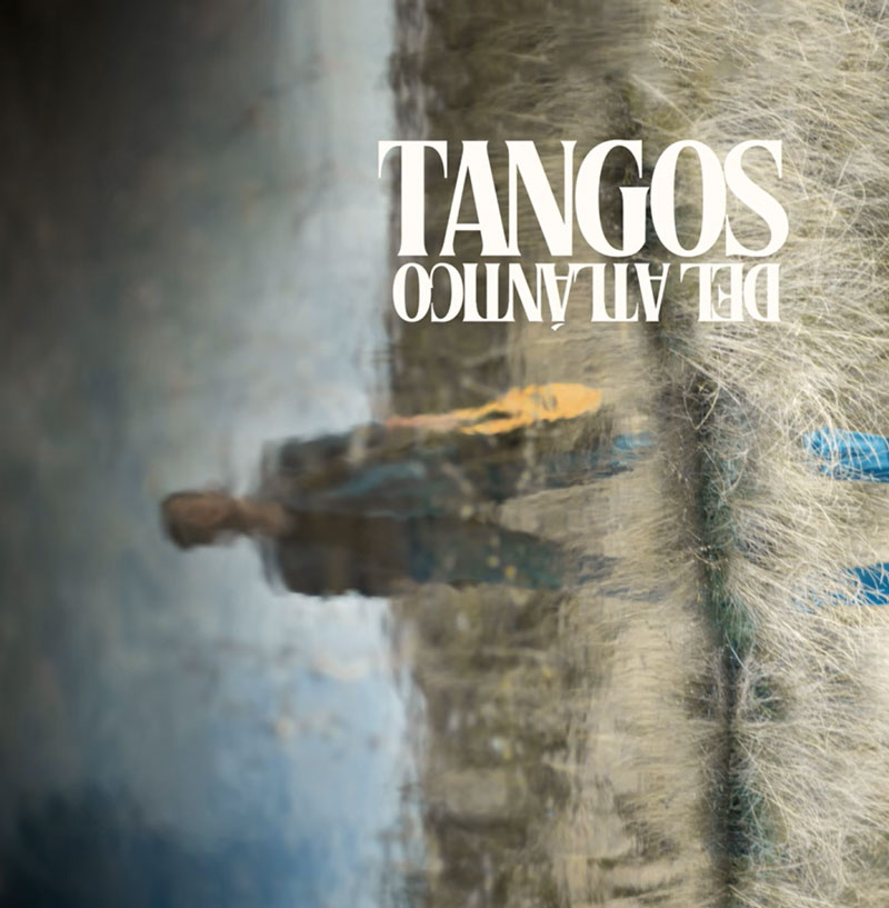 The cover of Pipo Romero's Tangos del Atlántico features an image resembling a reflection on water. A blurred figure appears distorted beside textured vertical lines that resemble mooring ropes or natural fibers. The album title is prominently displayed in bold, all-caps serif typeface, but it is flipped upside down.