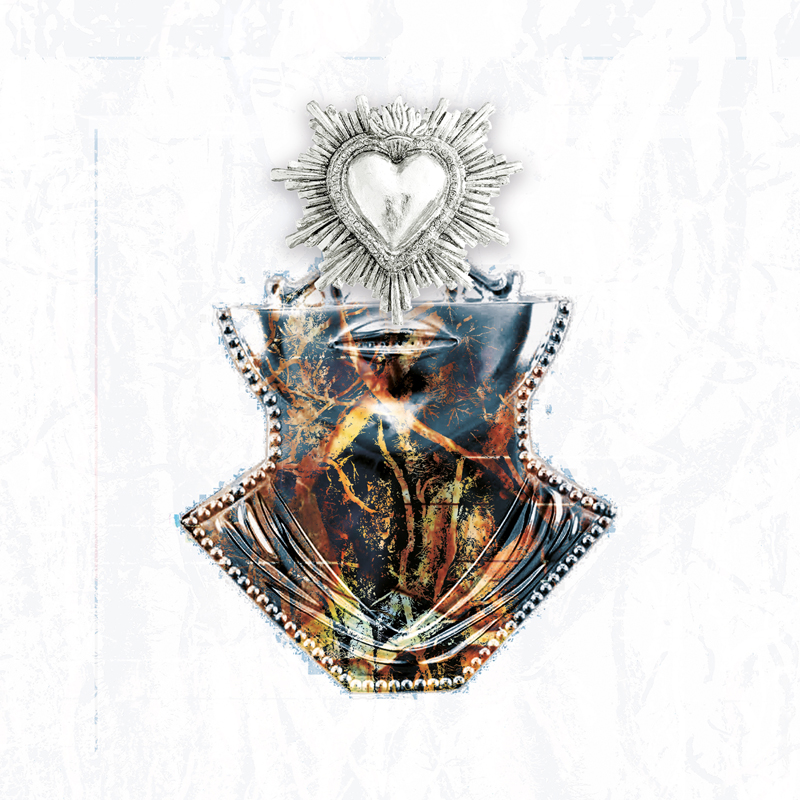 The album cover for Ra di Spina – Vocazioni features a symbolic image: a heart-shaped metallic emblem radiating like a sacred icon sits atop a stylized, glossy torso-like form. The central figure is encased in a dark, marbled texture, resembling cracked earth or burning roots. Beaded in silver edging. Set against a pale background.
