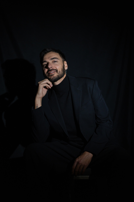 Raule resting his head on his hand.