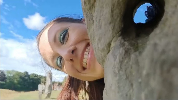 Richard Wileman Wheel Of Fortune. A still from the video with a woman smiling.