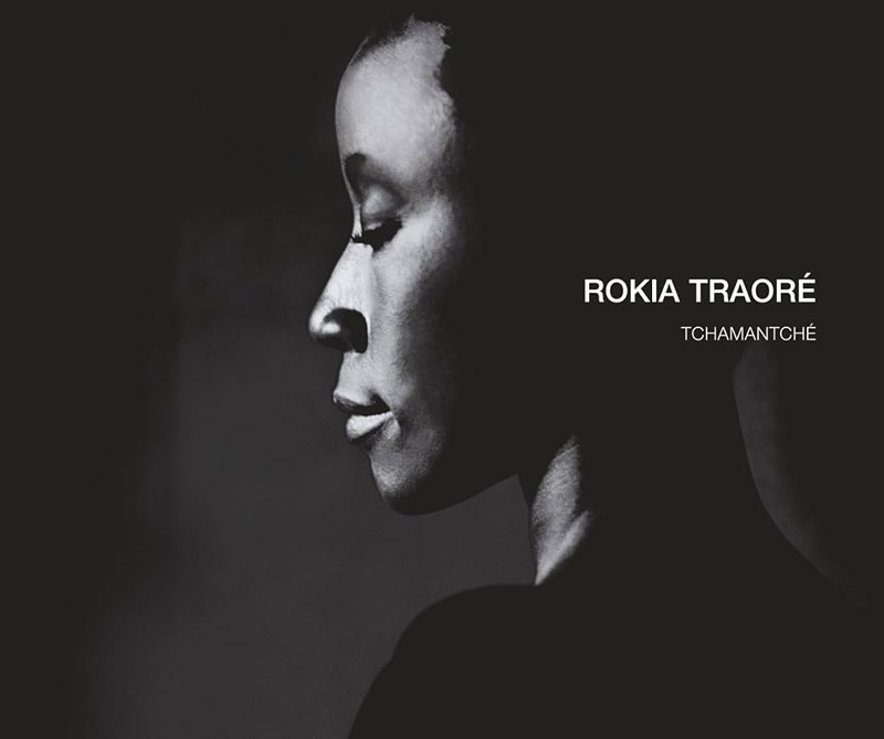 Rokia Traoré - Tchamantché cover artwork. Black and white profile photo of Rokia.