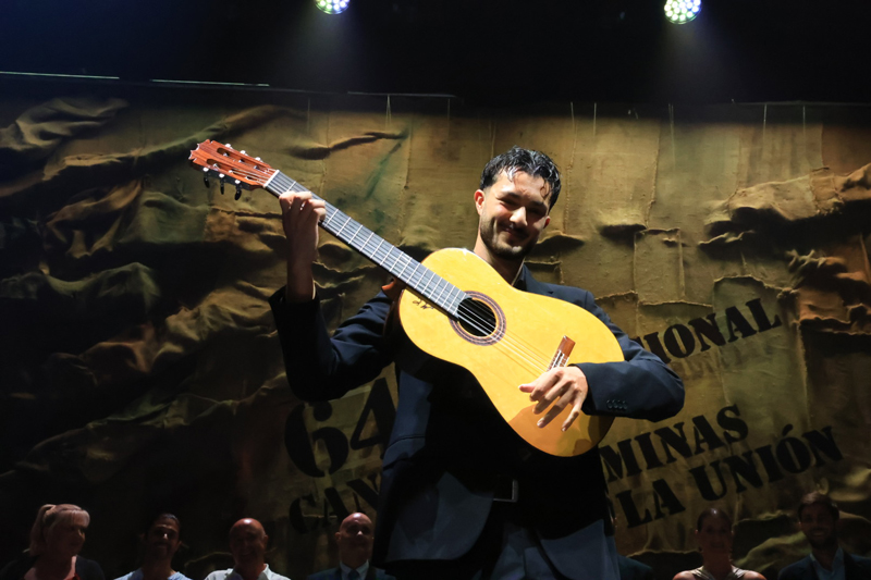 Samuel de Encarni - Photo courtesy of International Festival of Cante de las Minas. Samuel holding the guitar prize.