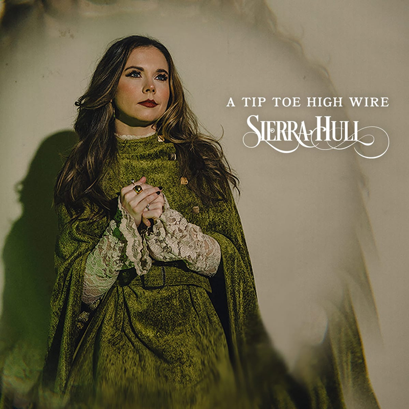 Sierra Hull A Tip Toe High Wire cover artwork. Sierra wearing a green dress.