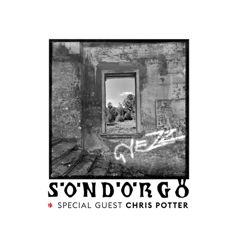 Sondorgo - Gyezz cover artwork. A photo taken from the interior of a house. You can see trees through a window.