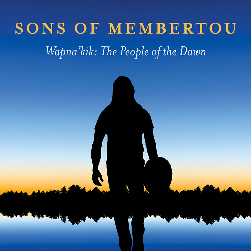 The album cover for Sons of Membertou – Wapna’kik: The People of the Dawn features a silhouette of a hooded figure holding a traditional hand drum, set against a serene twilight landscape. The background shows a gradient sky transitioning from deep blue to golden hues, reflecting on a calm body of water, with a distant tree line adding depth.