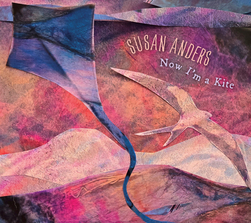 The album cover for Now I'm a Kite by Susan Anders features a collage-style illustration with layers in shades of pink, purple, and blue. A flowing kite and a bird in mid-flight dominate the scene. The artist’s name arcs above the bird, while the album title floats beside it in a handwritten font.