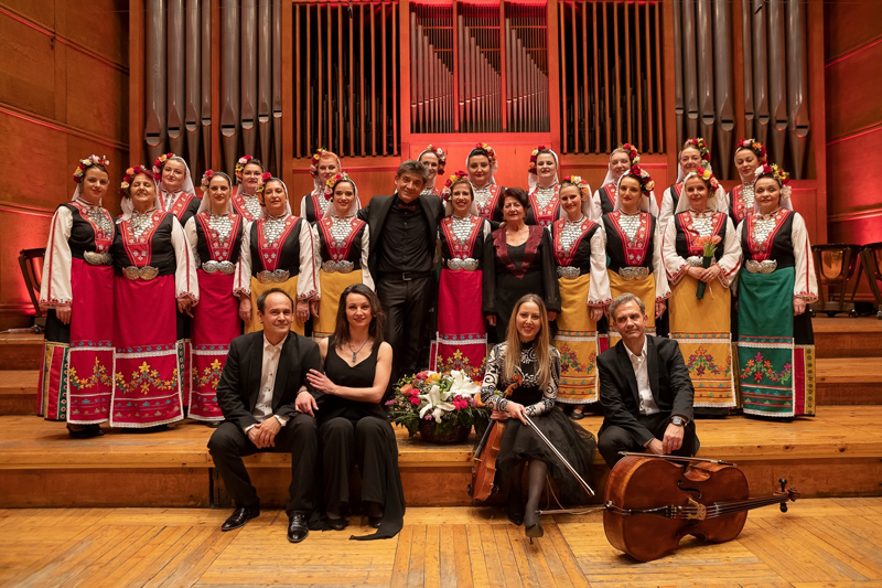 The Mystery of the Bulgarian Voices ensemble photo, posing on stage.